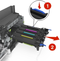 Press down the blue lever, and then grasp the green handles on the sides to pull out the imaging kit.