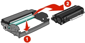 The illustration shows the button on the base of the photoconductor kit being removed to separate the toner cartridge.