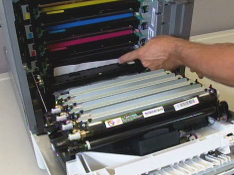 Remove the paper jam in front of the toner cartridge