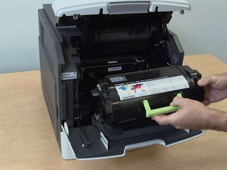 Insert the toner cartridge into the printer