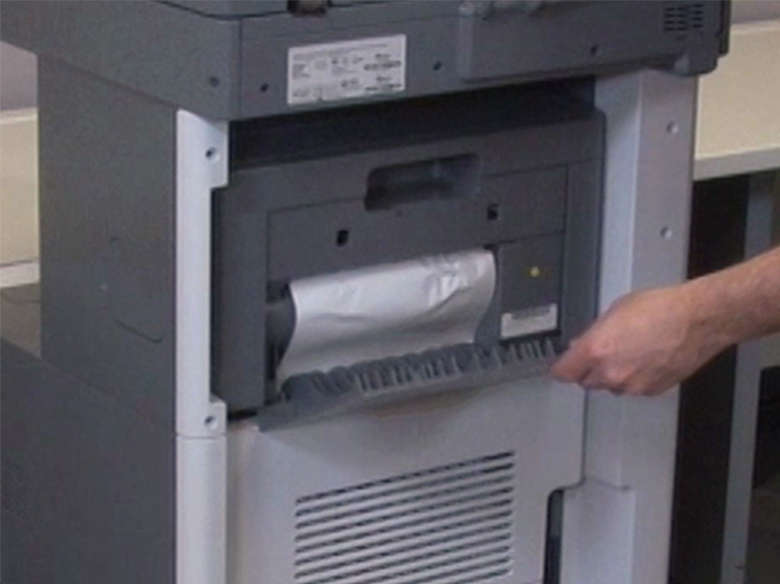 Open the StapleSmart finisher door, and then remove the jammed paper