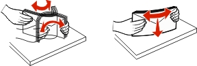 Flex and fan a stack of envelopes back and forth to loosen them, and then straighten the edges on a level surface.