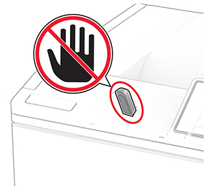 A do not touch icon is beside the flash drive that is inserted into the front USB port.