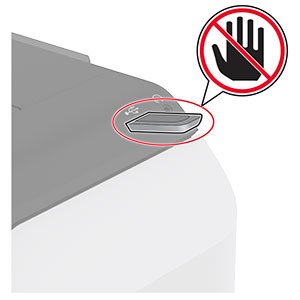 A do not touch icon is beside the flash drive that is inserted into the front USB port.
