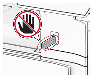 A do not touch icon is beside the flash drive that is inserted into the front USB port.