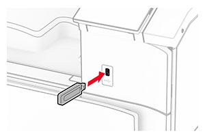 A flash drive is inserted into the front USB port.