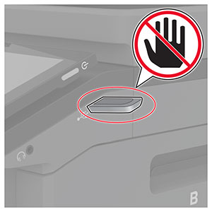 Um ícone "não toque" é colocado ao lado da unidade flash que está inserida na porta USB frontal.