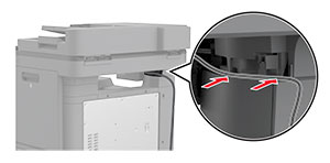 Muuntaja asetetaan tulostimen pylvääseen, jotta se pysyy paikallaan.
