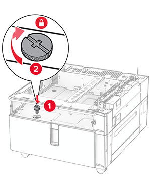 The screws are aligned to the tray base, and then turned clockwise.