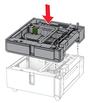 The 550-sheet tray is aligned and lowered into the tandem tray.