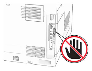 The fax port is at the back of the printer.