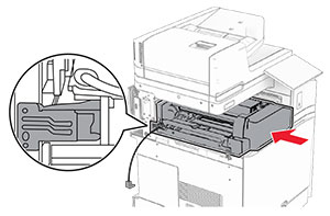 The paper transport with folding option is inserted into the printer, with the metal bracket in front of the printer.