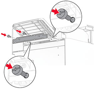 The trim cover is attached to the paper transport with folding option, and then secured with screws.