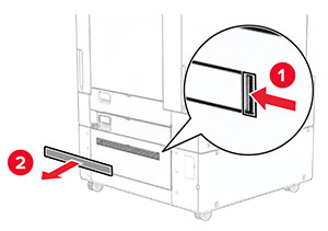 The tray cover is pried, and then removed from the printer.