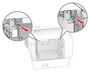 The screws of the paper guides are removed.