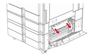 The jammed paper in door E is removed.