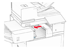 Jammed paper in the standard bin exit roller is removed.