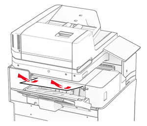 Jammed paper in the staple finisher bin is removed.