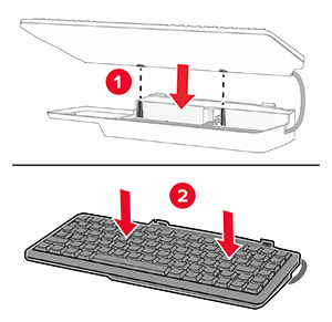 The keyboard is aligned, and then lowered into the keyboard shelf.