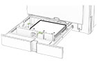 The prepunched paper is loaded facedown with the holes toward the front of the tray.