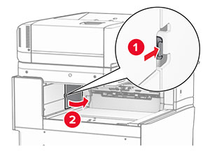 The paper transport connector cover is pried, and then removed from the printer.
