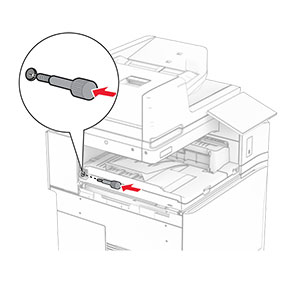 The screw is inserted into the rear slot of the paper transport.