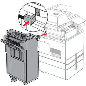 The staple, hole punch finisher is being attached to the printer.