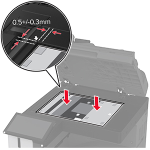Den nye scannerglaspude placeres på scannerens glasplade med klæbemidlerne vendt mod scannerdækslet.