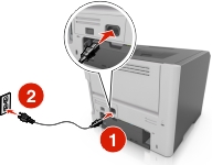 The power cord is plugged into the electrical outlet and into the printer.