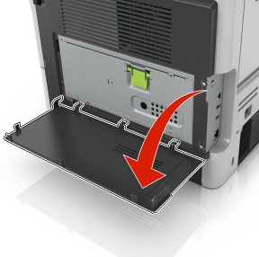 The illustration shows the system board door.