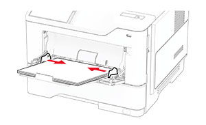 The paper guides are pushed toward the center of the multipurpose feeder.