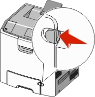 The illustration shows the tray release latch being pressed