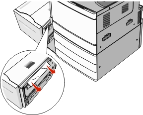 The illustration shows the jammed paper being removed from the tray exit.