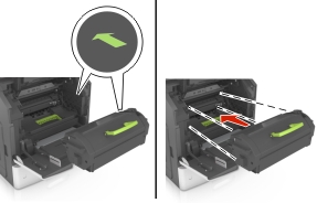 Insert the toner cartridge into the printer by aligning the side rails of the cartridge with the arrows on the side rails inside the printer.