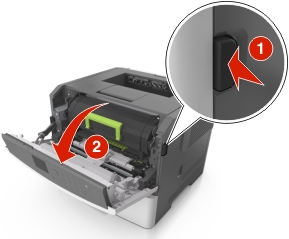 Release latch on the right side of the printer is pushed to open the front door.