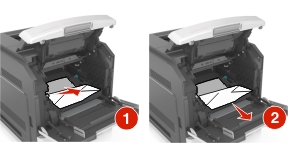 Pull the jammed paper gently to the right, and then remove it from the printer.