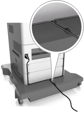 Cables connected to the ports at the back of the printer