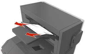 From the stapler bin, firmly grasp the jammed paper on each side, and then gently pull it out.