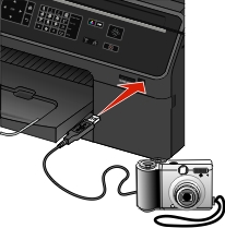 The illustration shows the  USB cable  being inserted  into the Pictidge port of the printer.