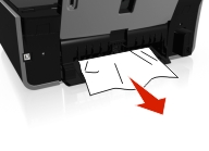 The illustration shows the jammed paper being removed.