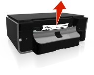 The illustration shows the paper being removed.
