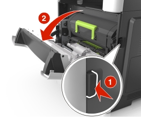 Push the release latch on the right side of the printer to open the front door.