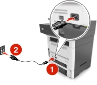 The power cord is plugged into the electrical outlet and into the printer.