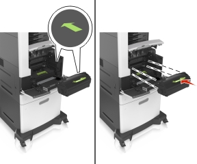 Insert the toner cartridge into the printer by aligning the side rails of the cartridge with the arrows on the side rails inside the printer.